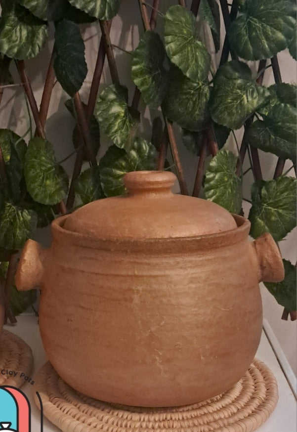 pots with lids on woven coasters